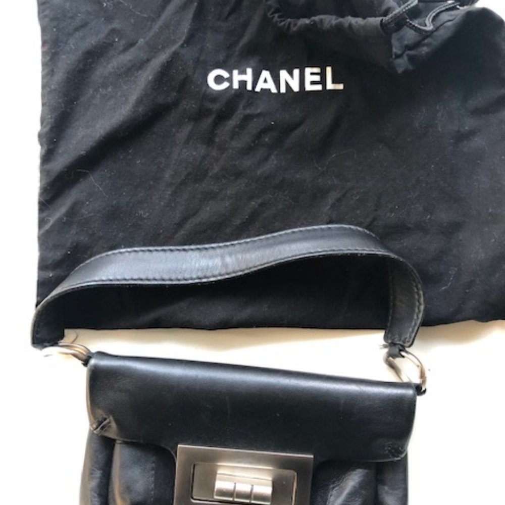 black Chanel pochette purse